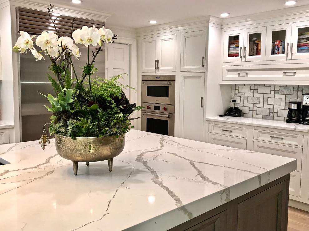 Inspiration for a large transitional eat-in kitchen remodel in New York with beaded inset cabinets, gray cabinets, quartz countertops and an island