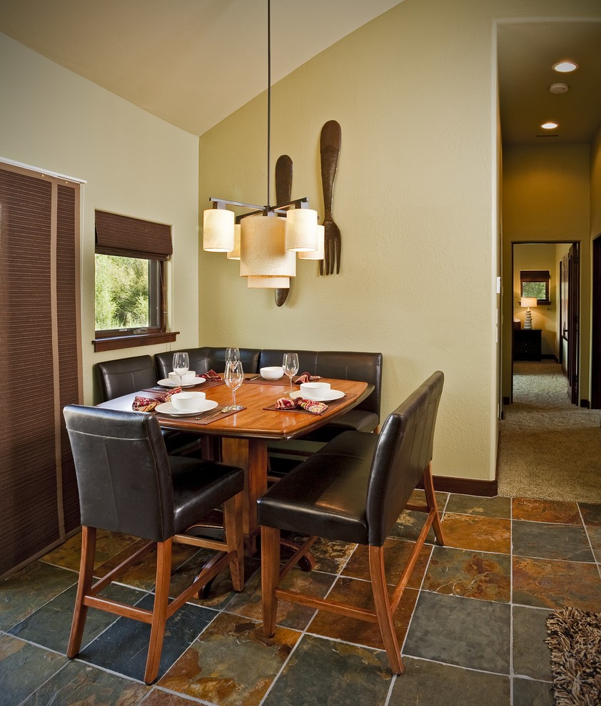 Photo of a small country dining room in Tampa with beige walls, ceramic floors, multi-coloured floor and no fireplace.