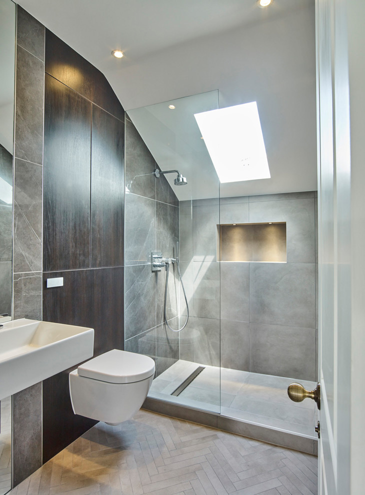 Inspiration for a mid-sized contemporary kids bathroom in London with recessed-panel cabinets, dark wood cabinets, an open shower, gray tile, porcelain tile, white walls, porcelain floors and grey floor.