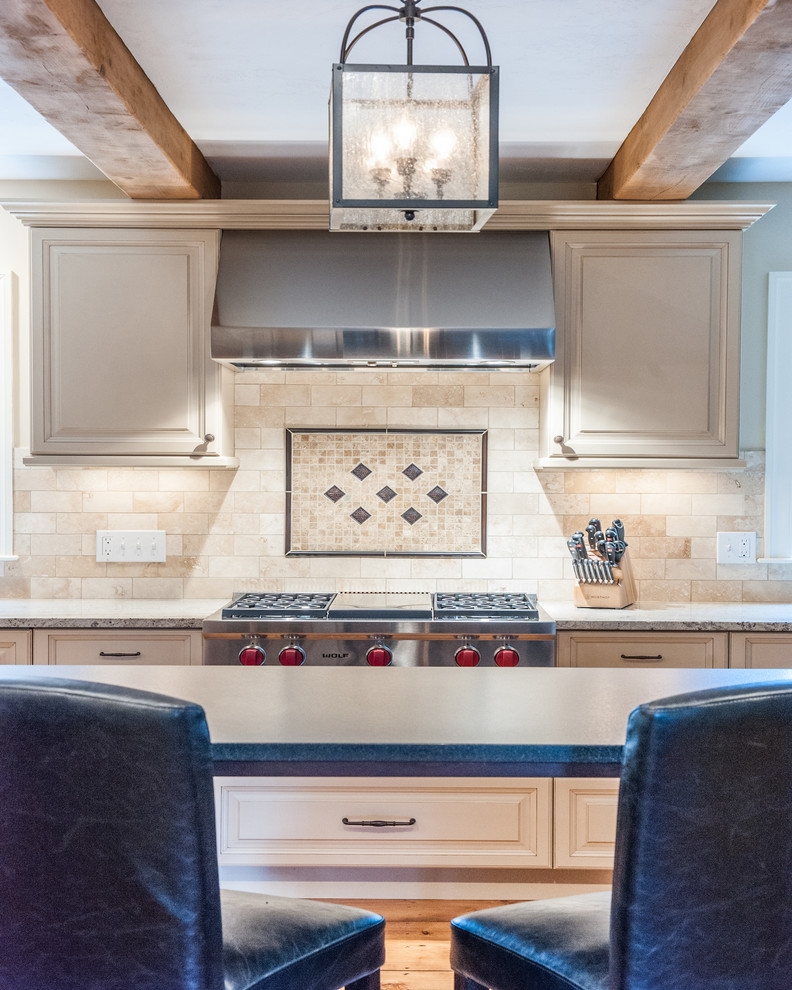 Eat-in kitchen - large transitional eat-in kitchen idea in Boston with an island
