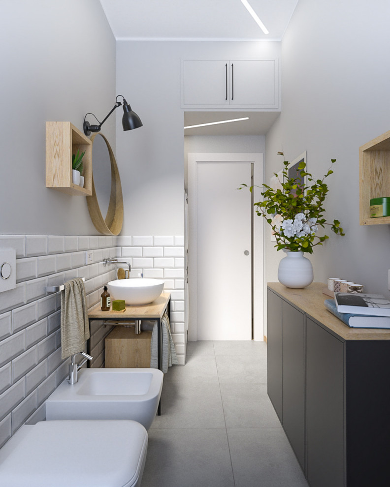 Design ideas for a mid-sized industrial 3/4 bathroom in Milan with open cabinets, black cabinets, an alcove shower, a wall-mount toilet, white tile, subway tile, grey walls, porcelain floors, a vessel sink, wood benchtops, grey floor, a sliding shower screen, a laundry, a single vanity, a freestanding vanity and recessed.
