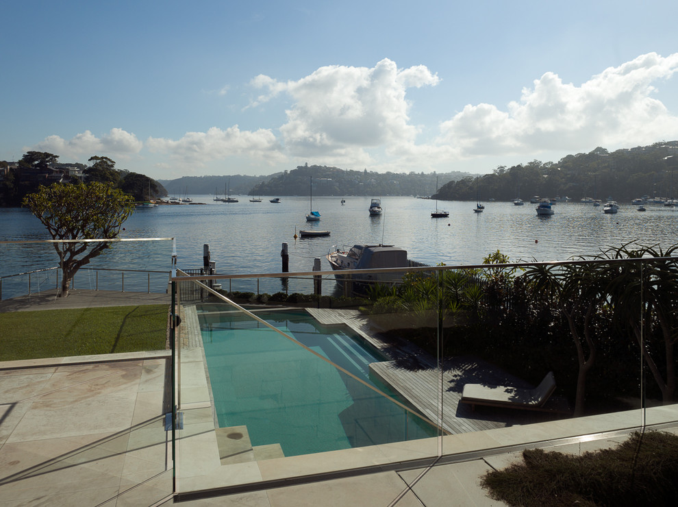 Design ideas for a contemporary backyard rectangular pool in Sydney with decking.