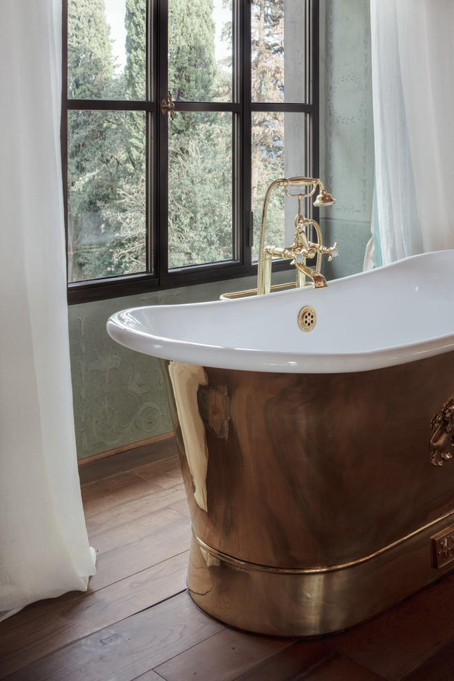 Photo of a mid-sized traditional bathroom in Florence with a freestanding tub.