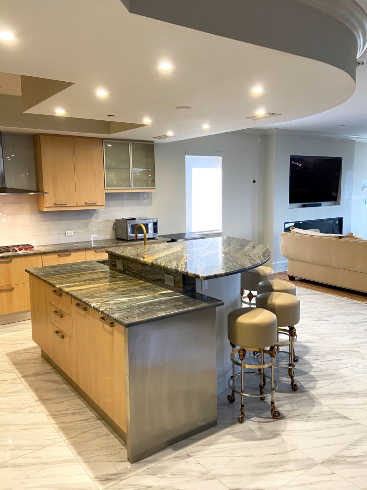 Inspiration for a transitional kitchen remodel in Tampa with quartzite countertops and an island