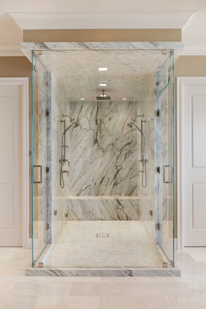 Bathroom - large modern master white tile and marble tile marble floor, white floor and double-sink bathroom idea in Miami with recessed-panel cabinets, white cabinets, white walls, an undermount sink, marble countertops, a hinged shower door, white countertops and a built-in vanity