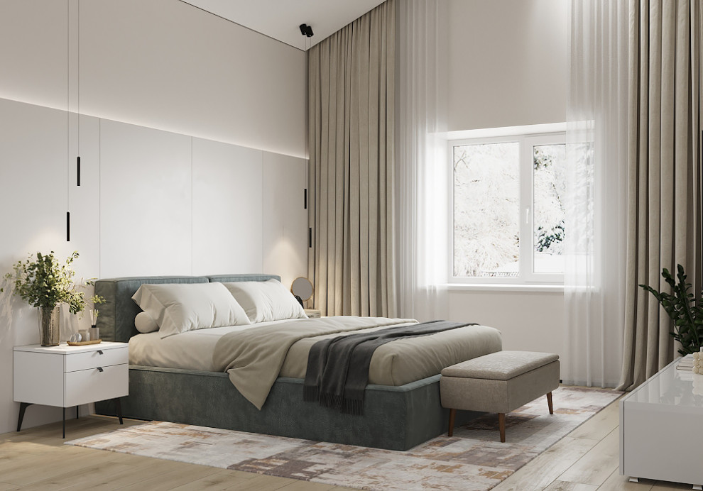 Ejemplo de dormitorio principal y abovedado contemporáneo de tamaño medio sin chimenea con paredes beige, suelo laminado y suelo beige