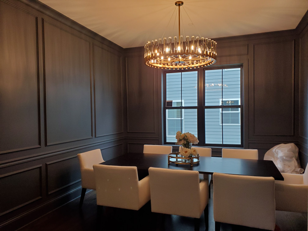 Design ideas for a medium sized classic enclosed dining room in Chicago with dark hardwood flooring and wainscoting.