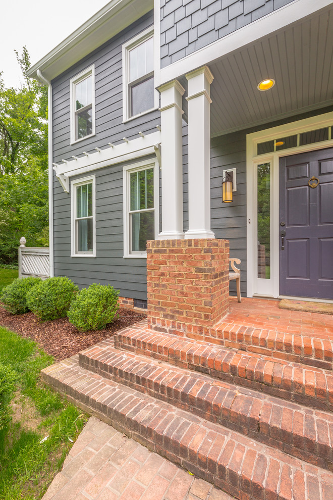 Front door - mid-sized traditional two-story wood gray front door idea with gray walls and a blue front door