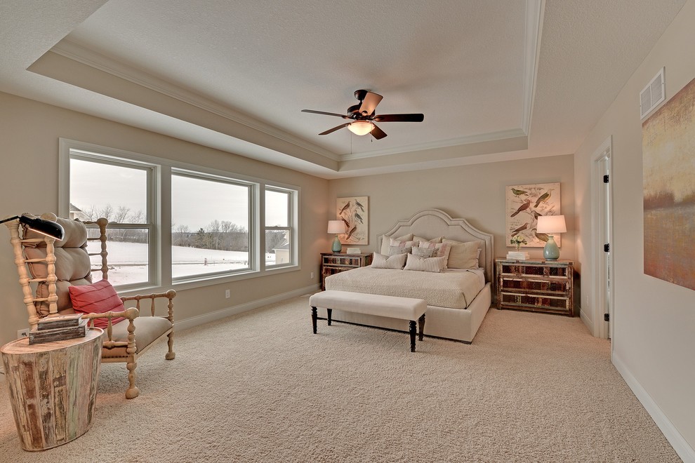 Inspiration for a large transitional master bedroom in Minneapolis with white walls, carpet and no fireplace.