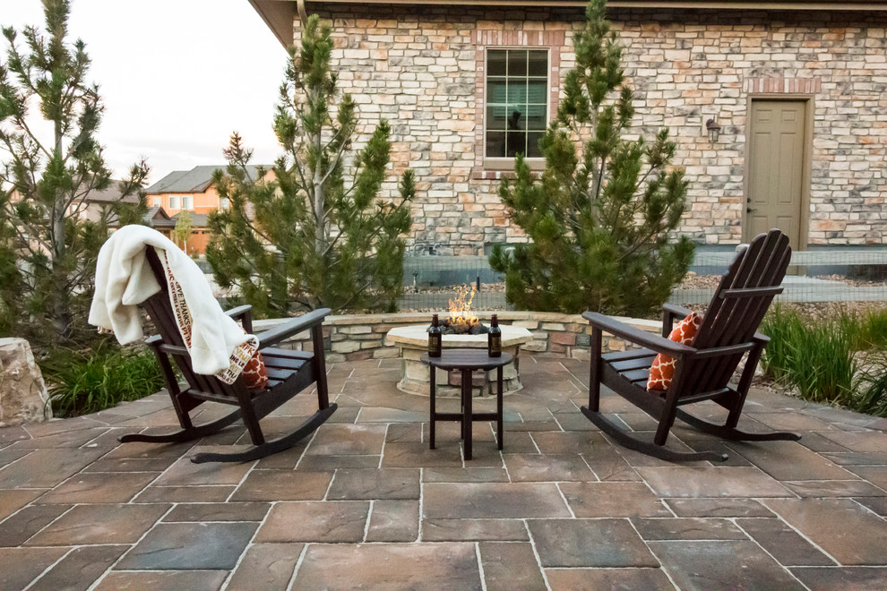 Patio - rustic brick patio idea in Denver with a fire pit