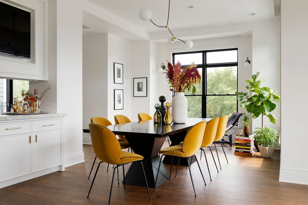 Inspiration for a contemporary dining room in Minneapolis with white walls, dark hardwood floors and brown floor.