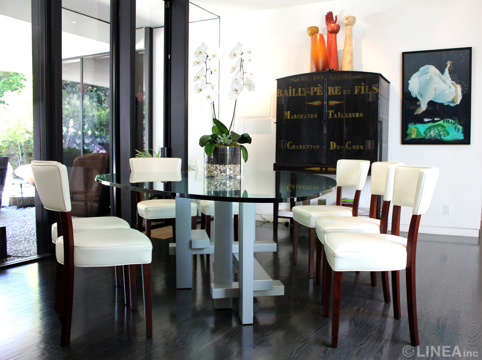 Inspiration for a mid-sized midcentury separate dining room in Los Angeles with white walls and dark hardwood floors.