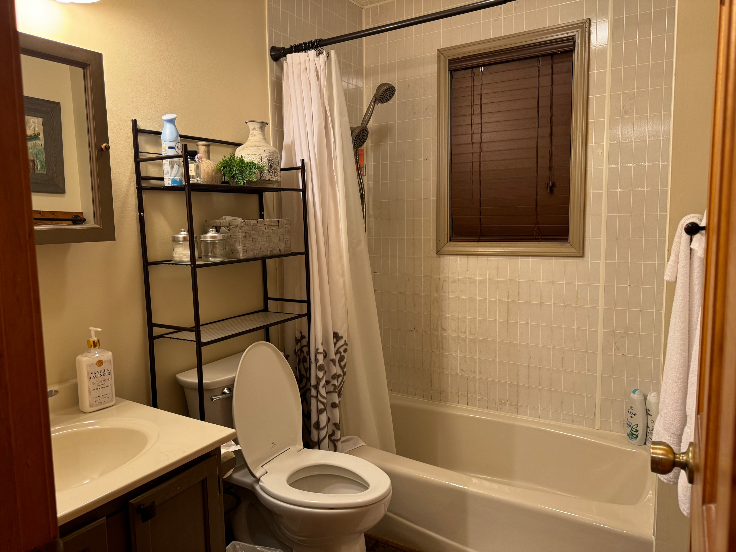 Rustic Farmhouse Bathroom Remodel with Wood-Look Tile and Pebble Shower Floor