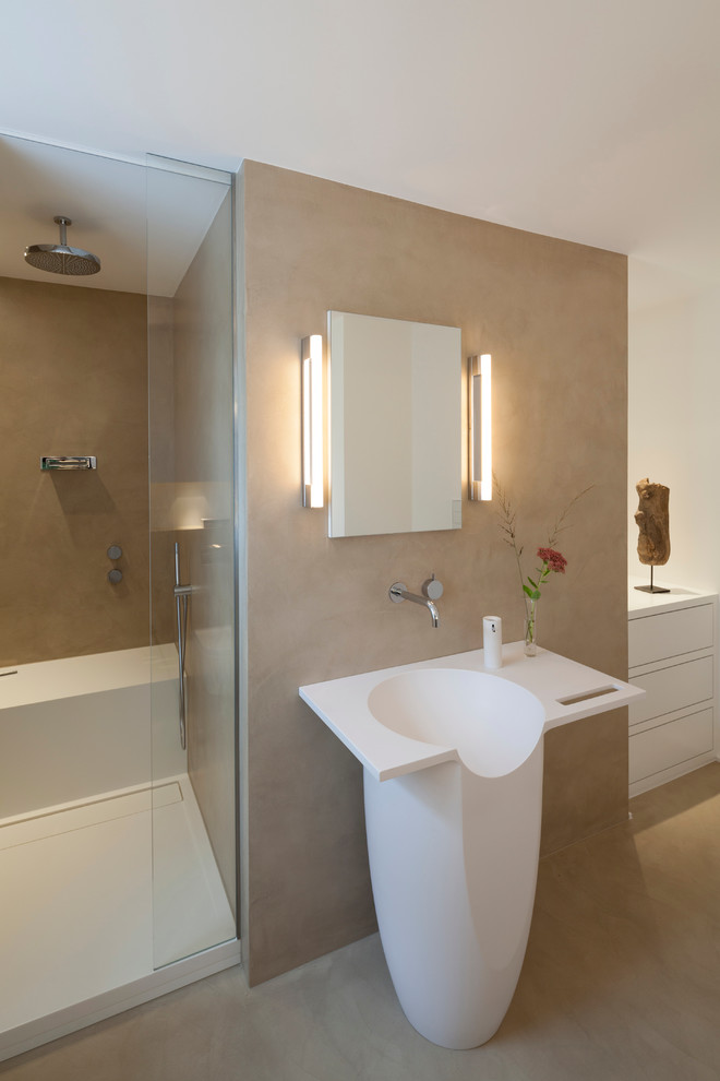 This is an example of a mid-sized contemporary 3/4 bathroom in Cologne with flat-panel cabinets, white cabinets, concrete floors, solid surface benchtops, beige floor and white benchtops.