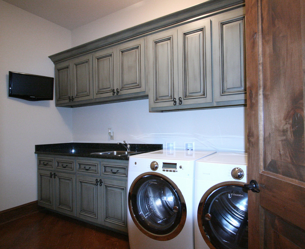 Inspiration for a traditional laundry room in Charlotte.