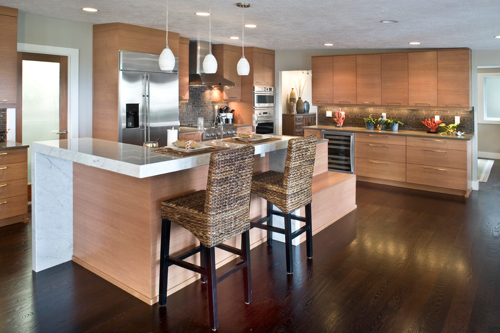 Photo of a mid-sized contemporary l-shaped open plan kitchen in Boise with flat-panel cabinets, medium wood cabinets, brown splashback, stainless steel appliances, an undermount sink, concrete benchtops, glass tile splashback, dark hardwood floors and with island.
