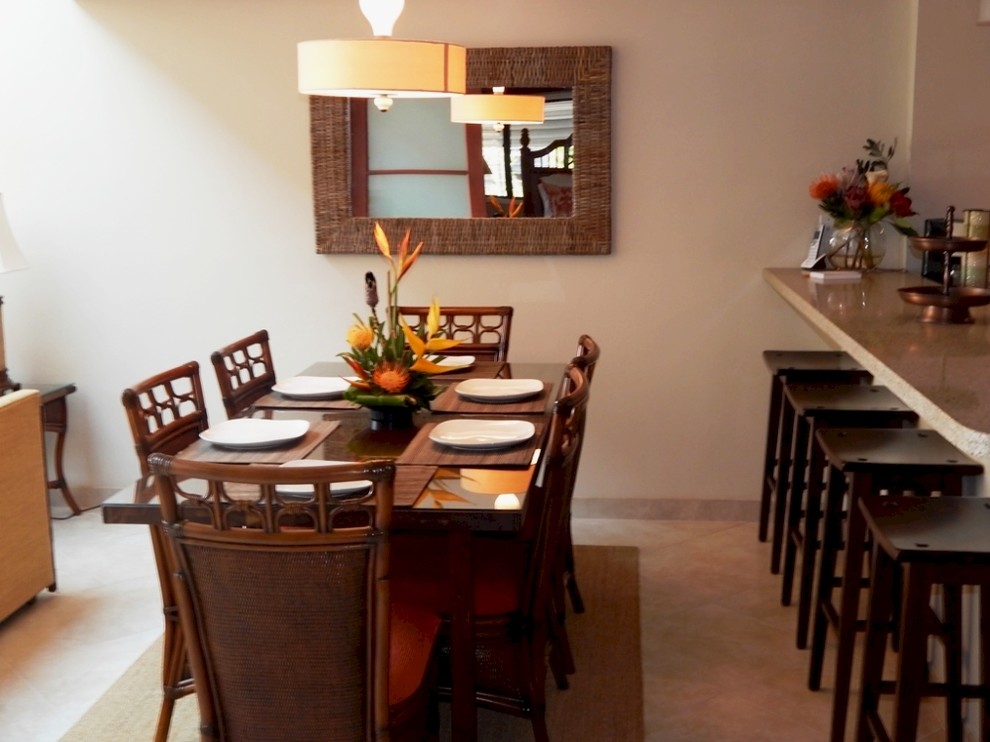 Inspiration for a small tropical kitchen/dining combo in Hawaii with beige walls, porcelain floors and no fireplace.