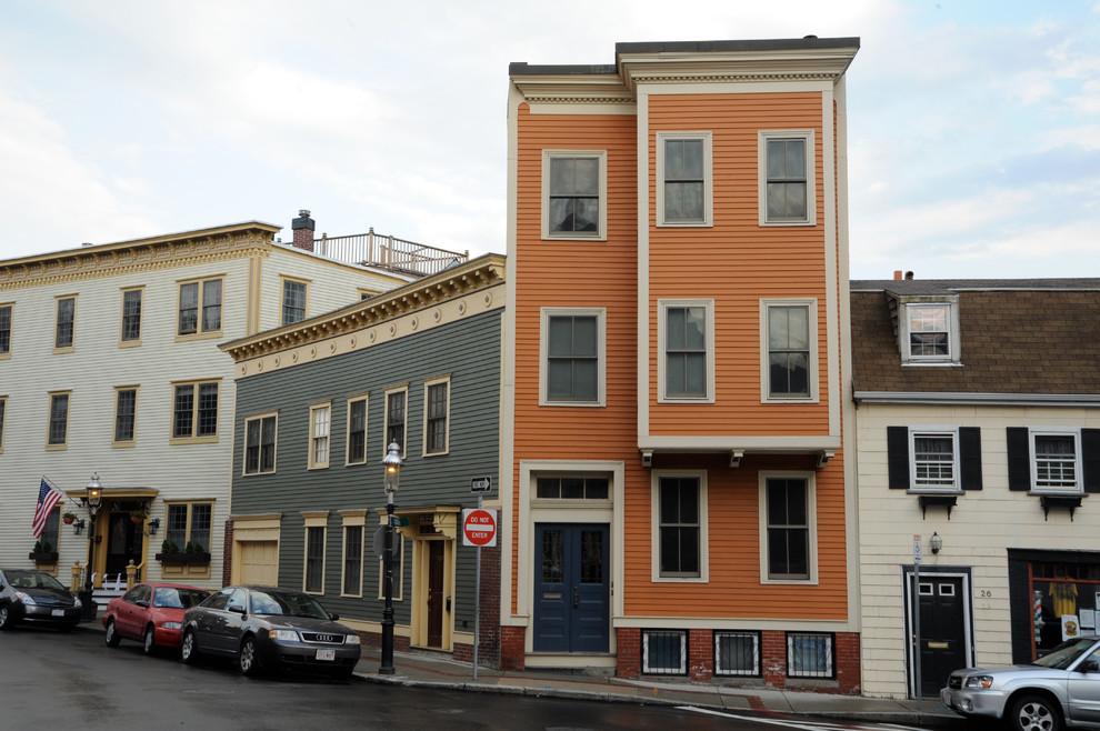 Example of a transitional home design design in Boston