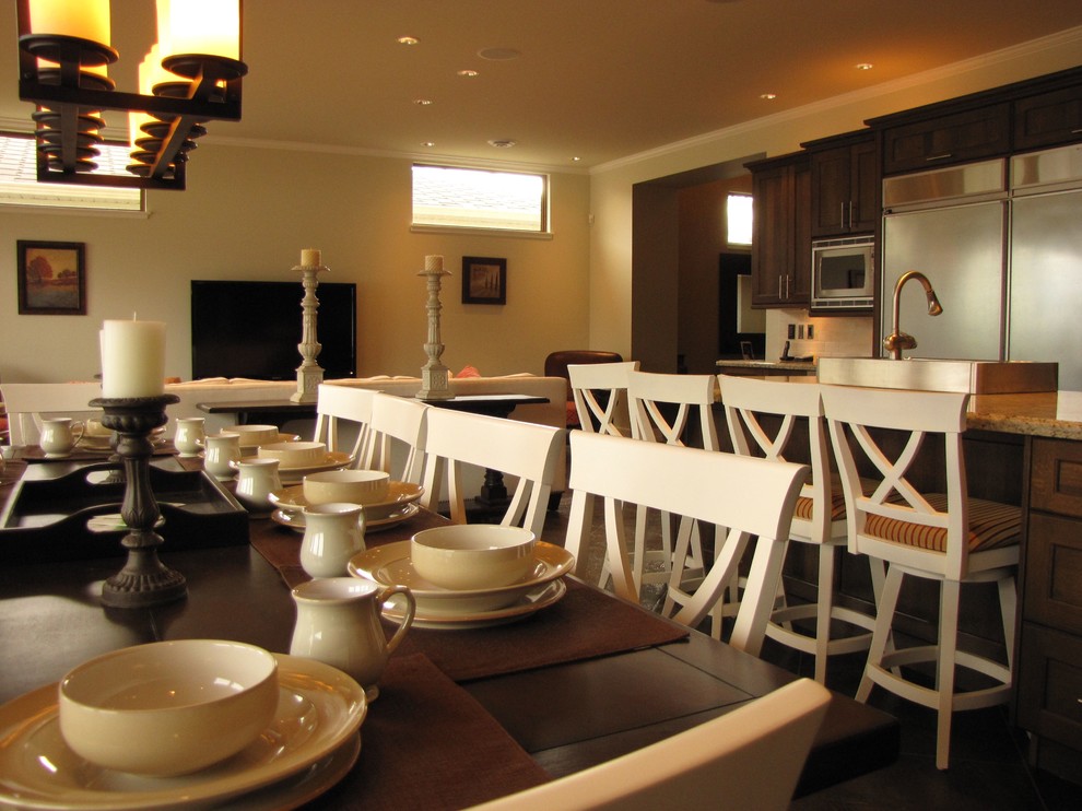 Photo of a mid-sized traditional open plan dining in Vancouver with beige walls, ceramic floors and brown floor.