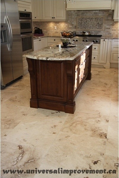Photo of a large traditional kitchen in Toronto with beige cabinets, travertine floors and beige floor.