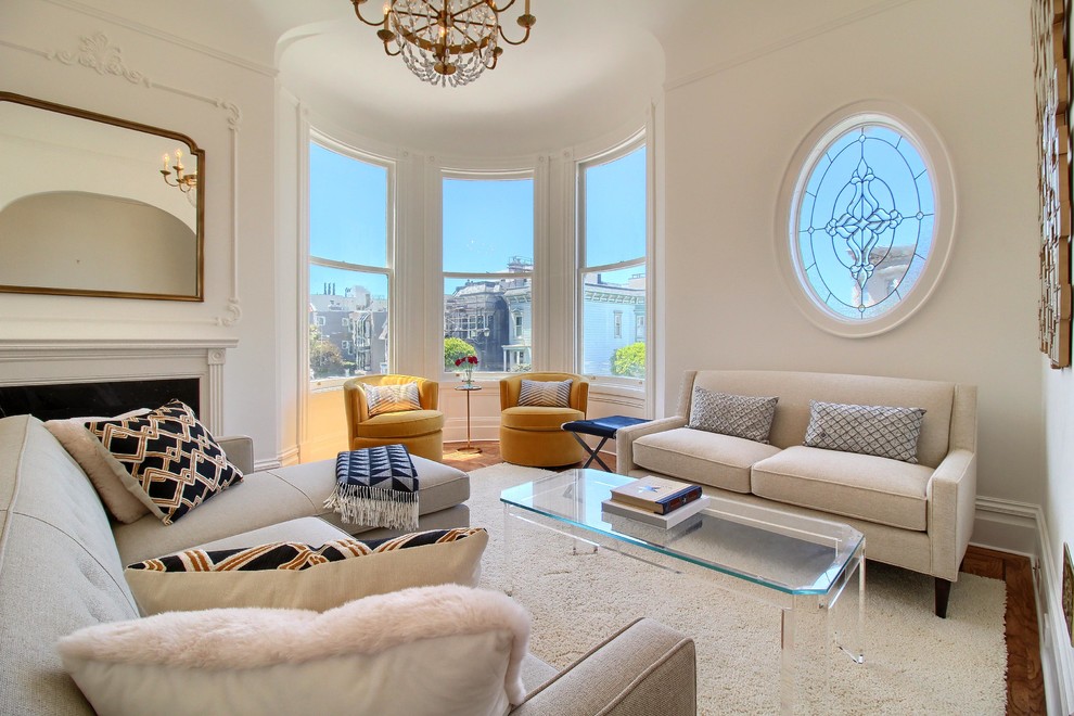 This is an example of a traditional enclosed living room in San Francisco with white walls and a standard fireplace.