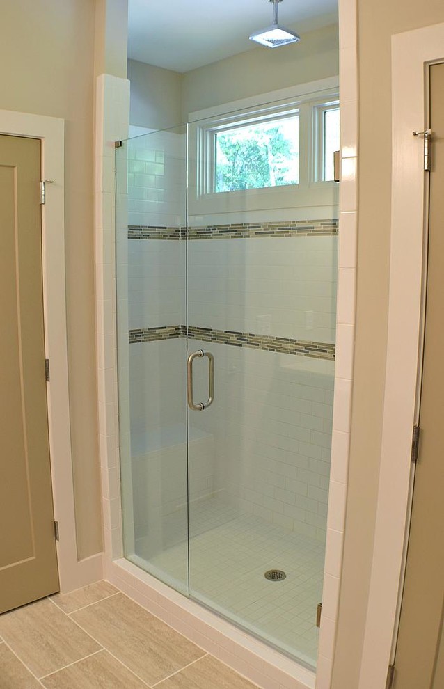 Inspiration for a mid-sized modern master white tile and subway tile ceramic tile doorless shower remodel in Atlanta with shaker cabinets, dark wood cabinets, a one-piece toilet and beige walls