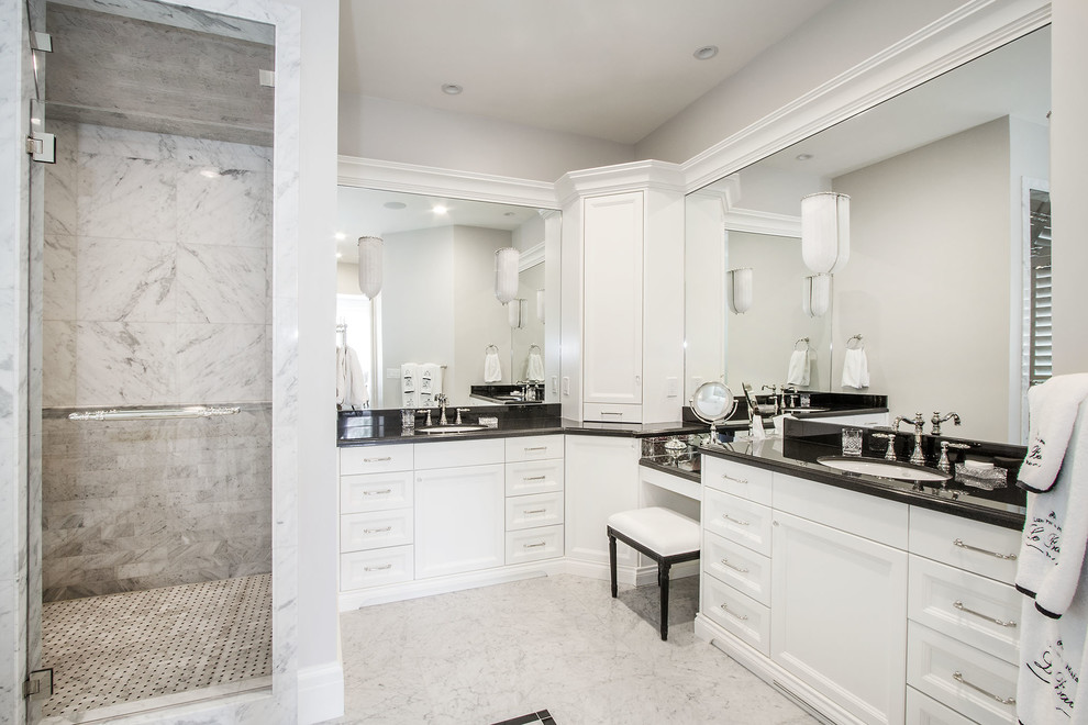 Large country master bathroom in Salt Lake City with recessed-panel cabinets, white cabinets, tile benchtops, an alcove shower, white walls, marble floors, an undermount sink, a drop-in tub, gray tile, marble, grey floor, a hinged shower door and black benchtops.