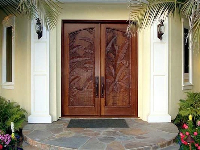 Photo of a transitional front door in Charleston with a double front door, a medium wood front door and yellow walls.
