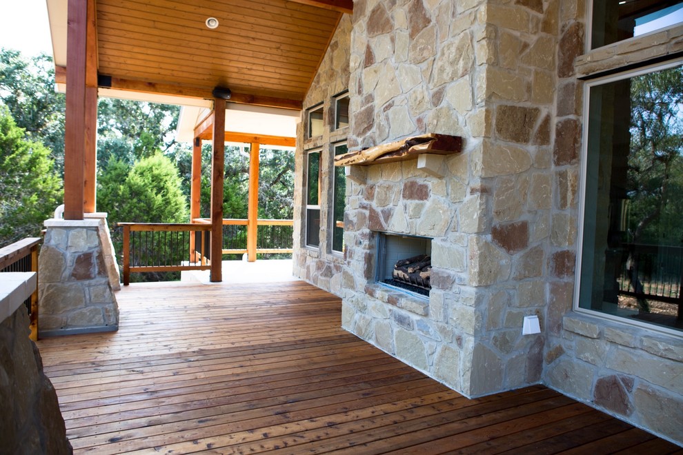 Deck - large rustic one-story and backyard stone beige deck idea in Austin with a shed roof, a fire pit and a roof extension