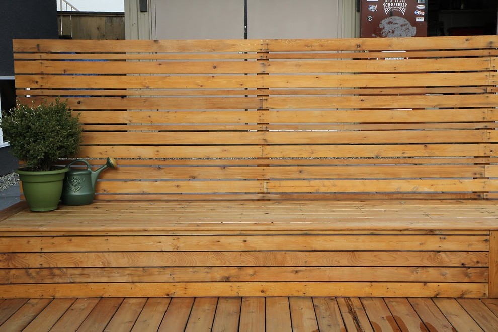 Inspiration for a large rustic backyard water fountain deck remodel in Vancouver with no cover