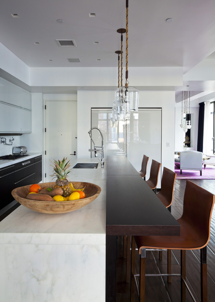 This is an example of a contemporary kitchen in San Francisco with wood benchtops.