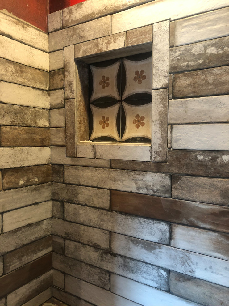Example of a mid-sized mountain style ceramic tile bathroom design