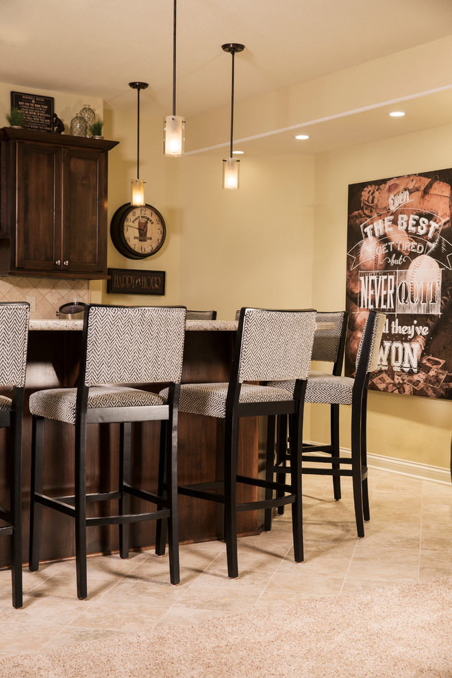 Example of a large transitional underground ceramic tile basement design in Milwaukee with beige walls and no fireplace