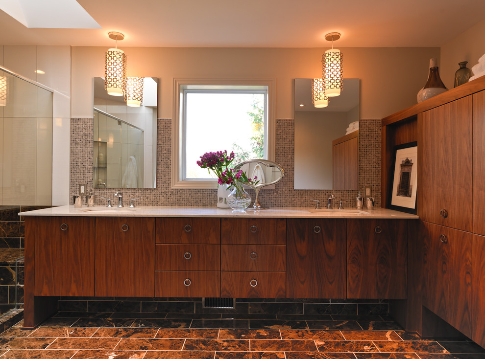 Photo of a large modern bathroom in Ottawa with flat-panel cabinets, medium wood cabinets, mosaic tile, an undermount sink, beige walls and brown floor.