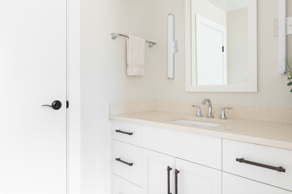 Design ideas for a mid-sized transitional bathroom in Other with shaker cabinets, white cabinets, porcelain floors, an undermount sink, quartzite benchtops, grey floor and white benchtops.