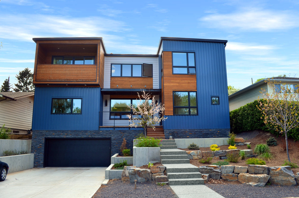 Design ideas for a contemporary exterior in Calgary with metal siding.