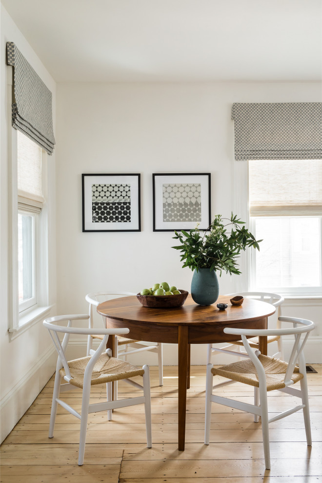 Inspiration for a small transitional light wood floor and yellow floor dining room remodel in Boston with white walls