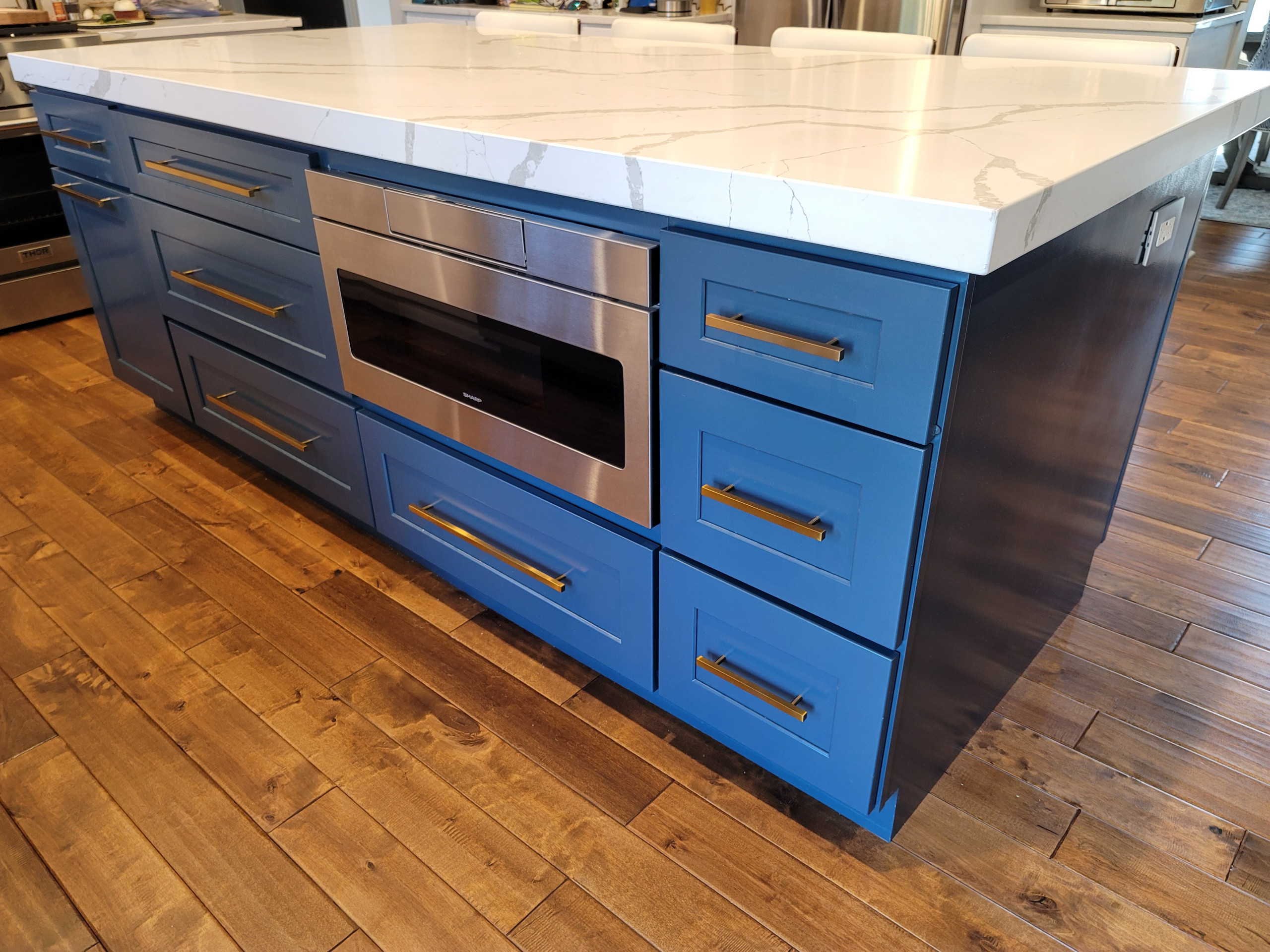 Modern kitchen design and remodel. Shaker style cabinets in white and blue.