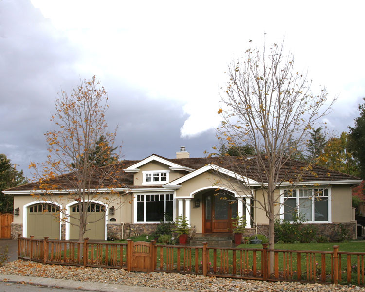 Inspiration for a mid-sized traditional one-storey beige exterior in San Francisco with mixed siding and a hip roof.