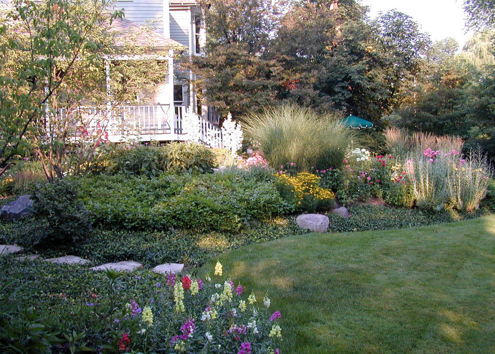 Design ideas for an eclectic backyard partial sun garden for summer in Chicago.
