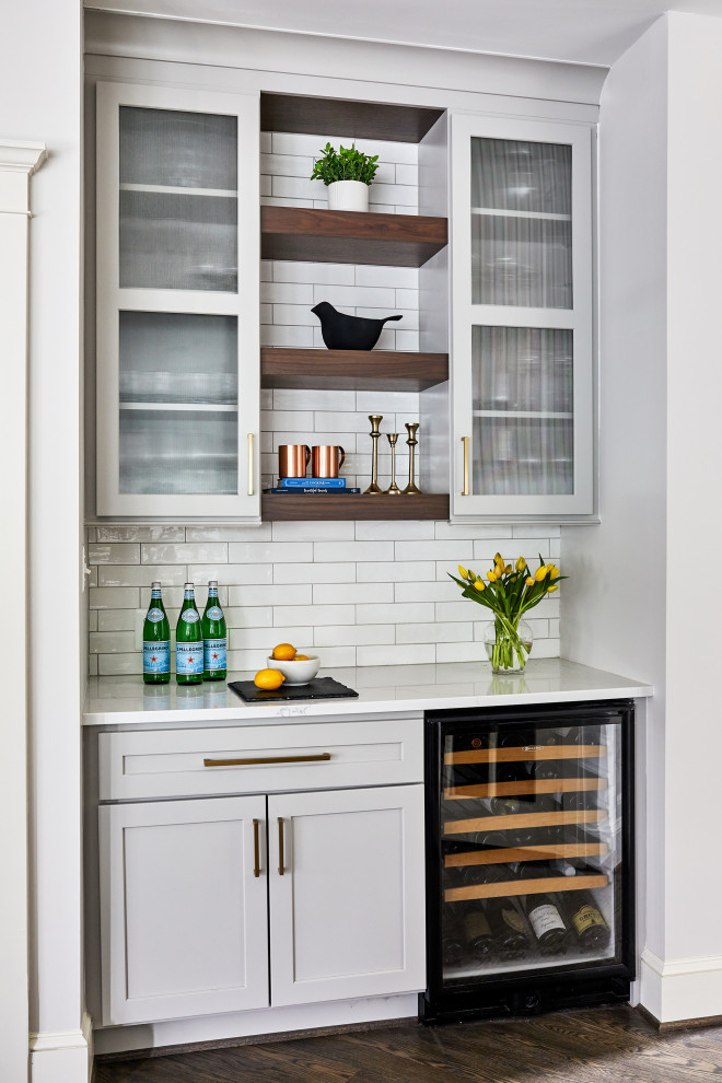 Example of a transitional home bar design in Boston
