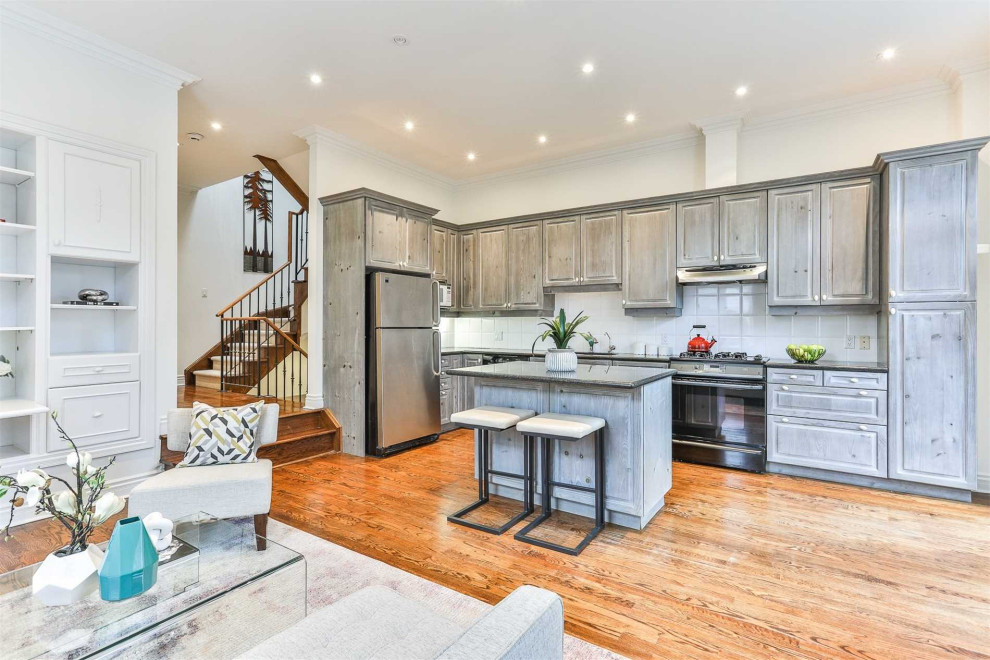Example of a transitional kitchen design in Toronto