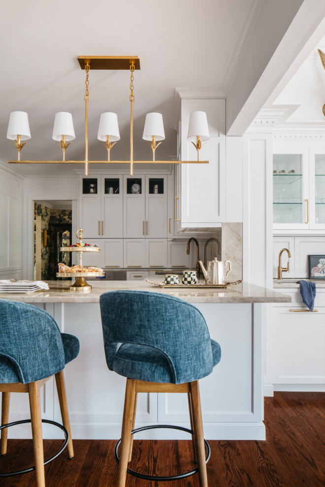 Eat-in kitchen - large transitional dark wood floor and brown floor eat-in kitchen idea in Chicago with recessed-panel cabinets, white cabinets, quartzite countertops, beige backsplash, a peninsula and beige countertops