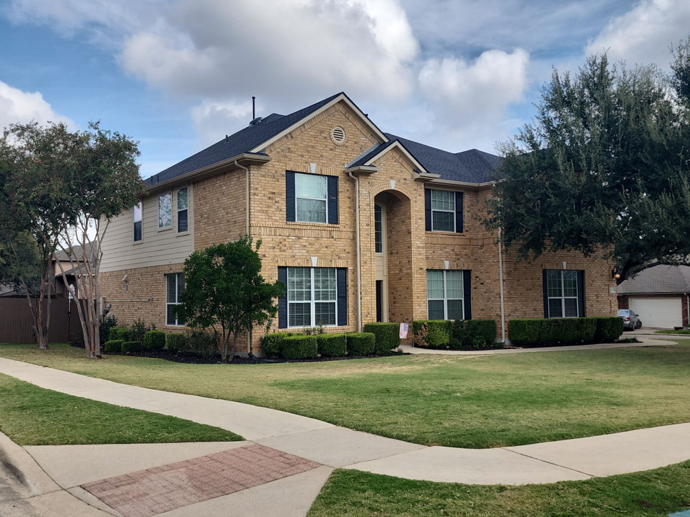Two-story board and batten exterior home photo