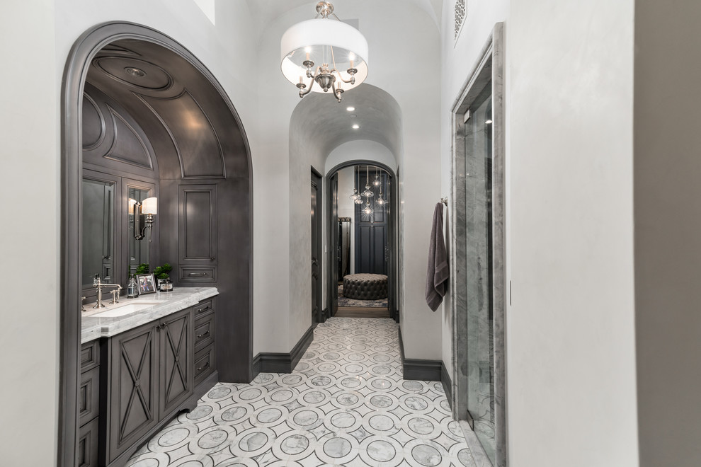 Inspiration for an expansive transitional master bathroom in Phoenix with furniture-like cabinets, grey cabinets, a freestanding tub, an alcove shower, a one-piece toilet, white walls, marble floors, a drop-in sink, marble benchtops, multi-coloured floor, a hinged shower door and multi-coloured benchtops.