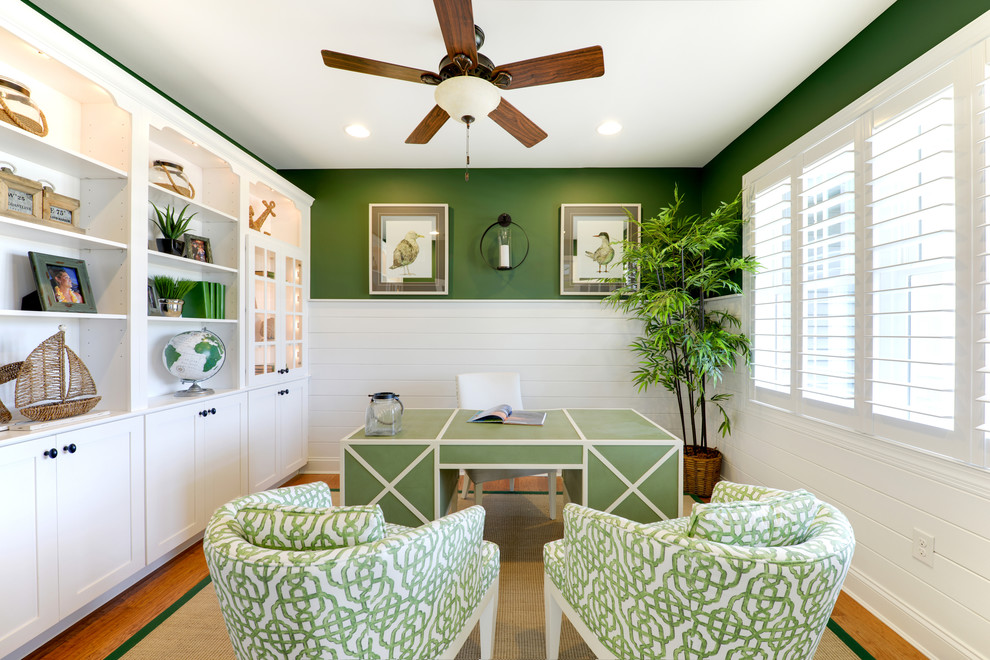 This is an example of a beach style study room in Philadelphia with green walls and a freestanding desk.