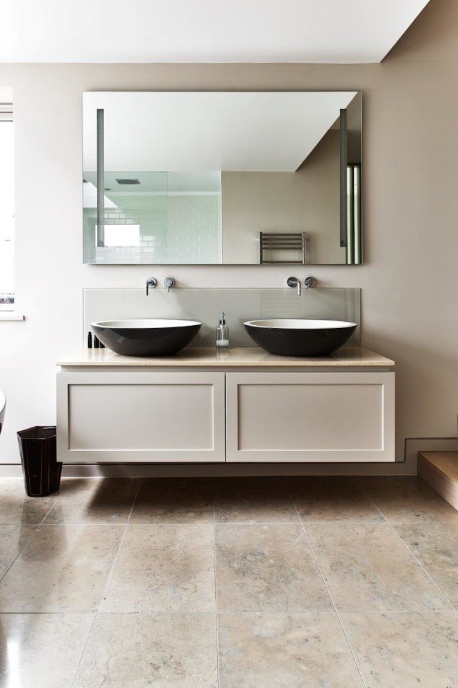 Inspiration for a modern bathroom in Wiltshire with grey cabinets and engineered quartz benchtops.