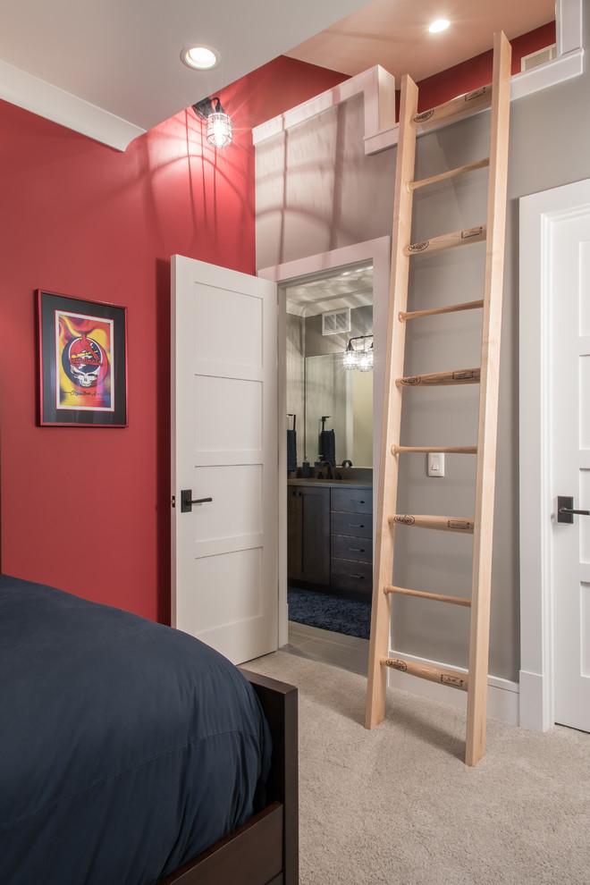 This is an example of a transitional kids' room for boys in Other with red walls, carpet and beige floor.