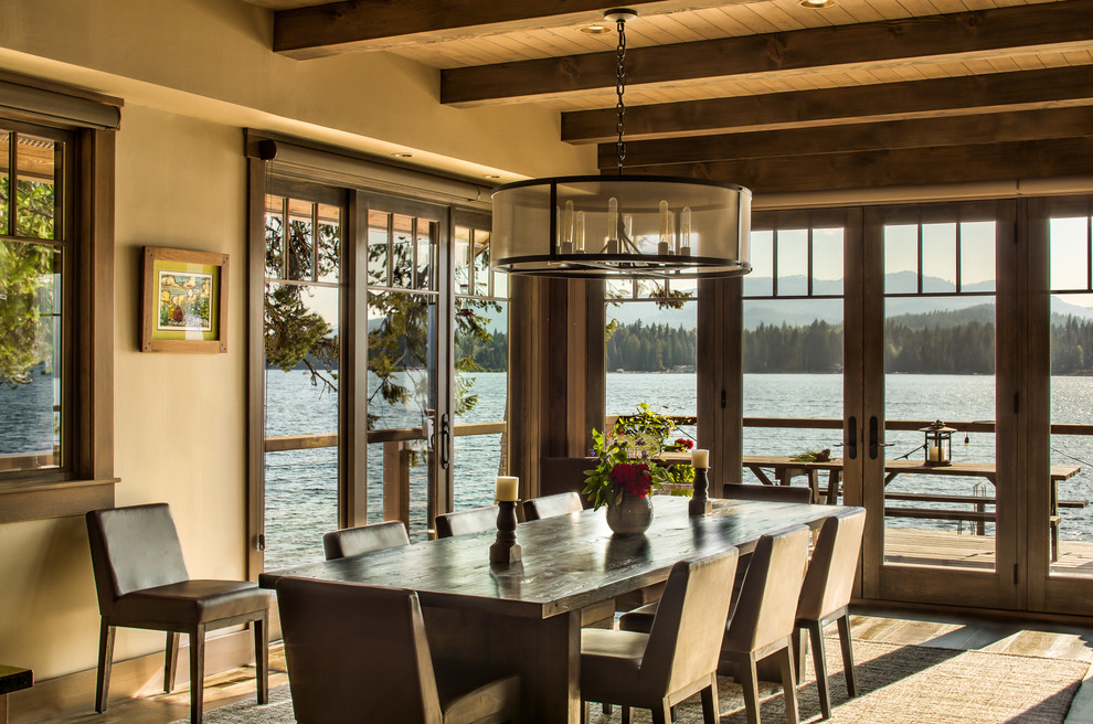 Inspiration for a country dining room in Other with beige walls, medium hardwood floors and brown floor.