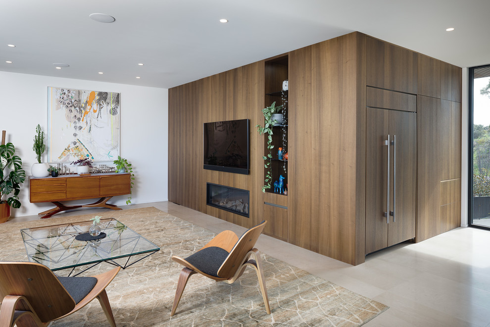 Contemporary open concept living room in Perth with white walls and grey floor.